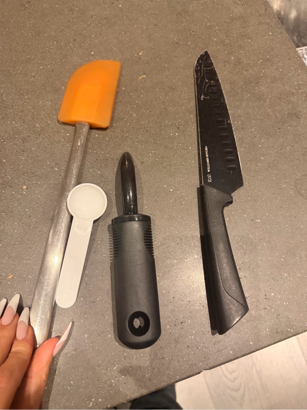 Assorted William Sonoma utensils including  Serrated Knife Peeler and Spatula